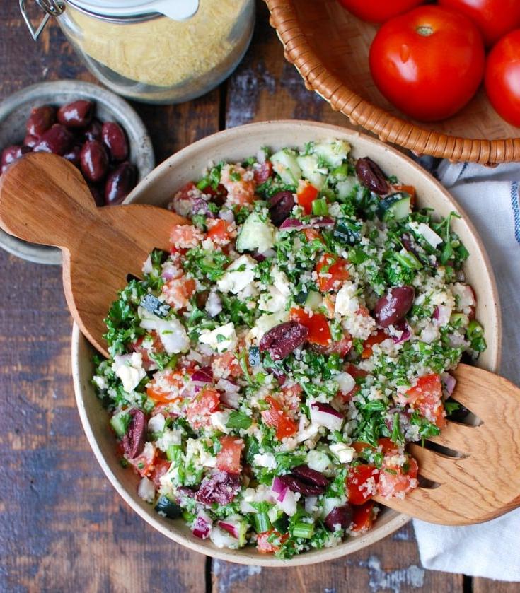 Ελληνικό Ταμπουλέ 3 Greek Tabbouleh with serving spoons.