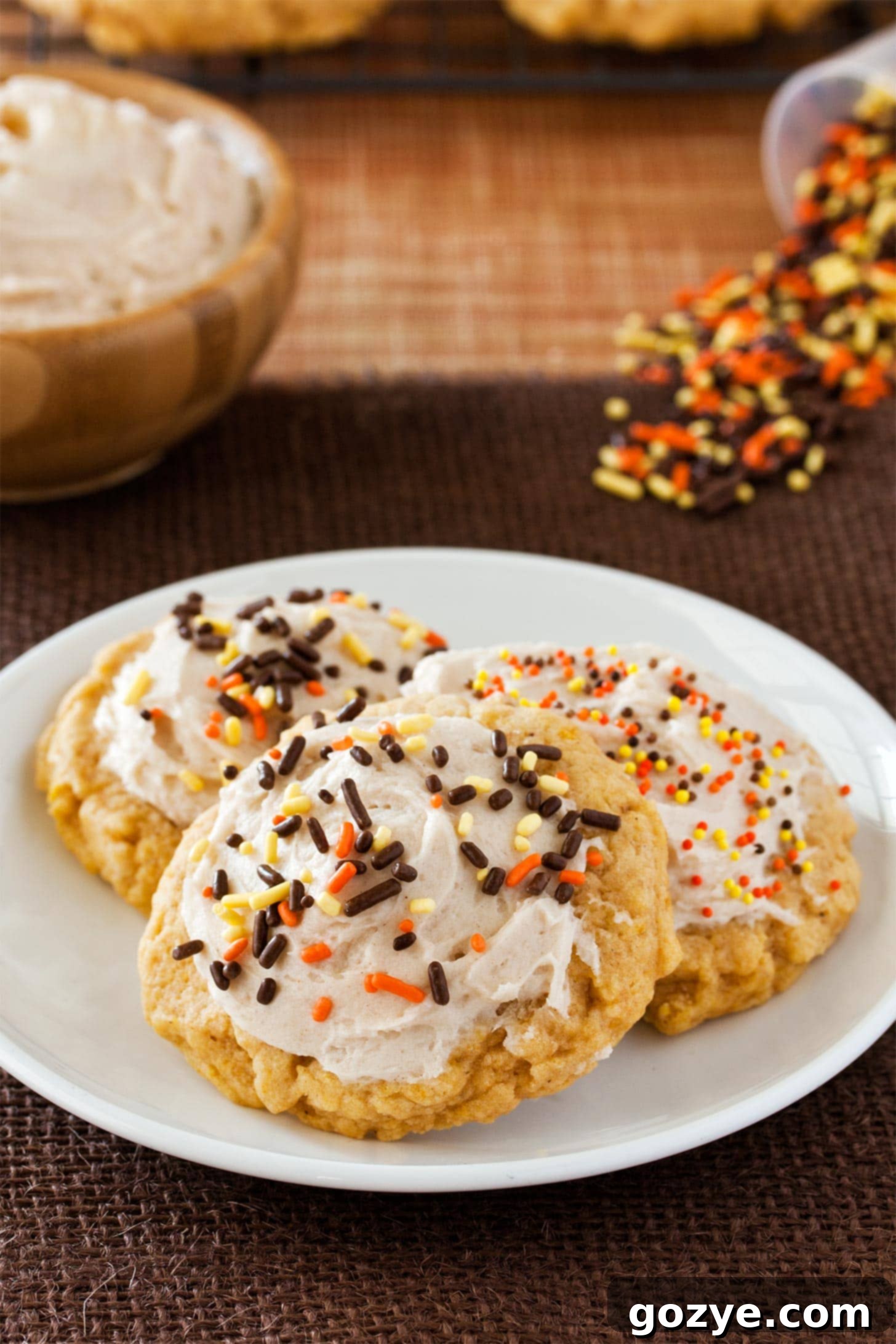 Small batch pumpkin cookies cooling on a wire rack on a white plate