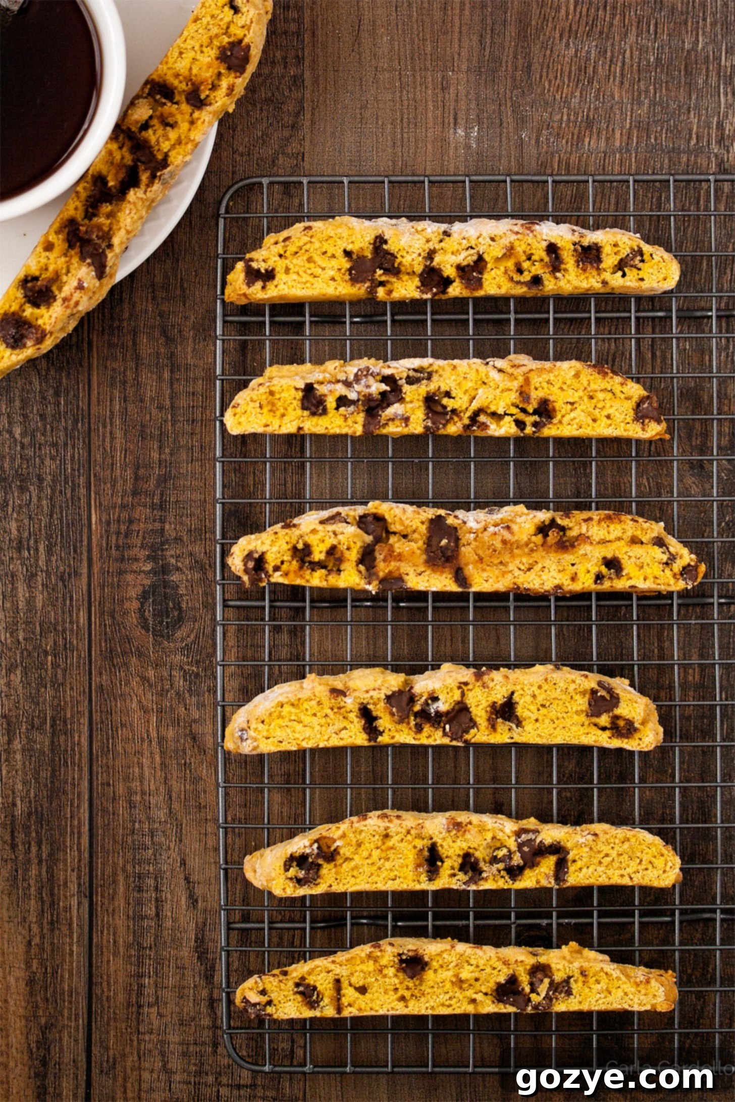 Golden pumpkin biscotti cooling on a wire rack, ready to be enjoyed.