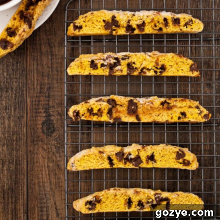 Beautifully sliced pumpkin biscotti cooling on a rack, ready to be served.