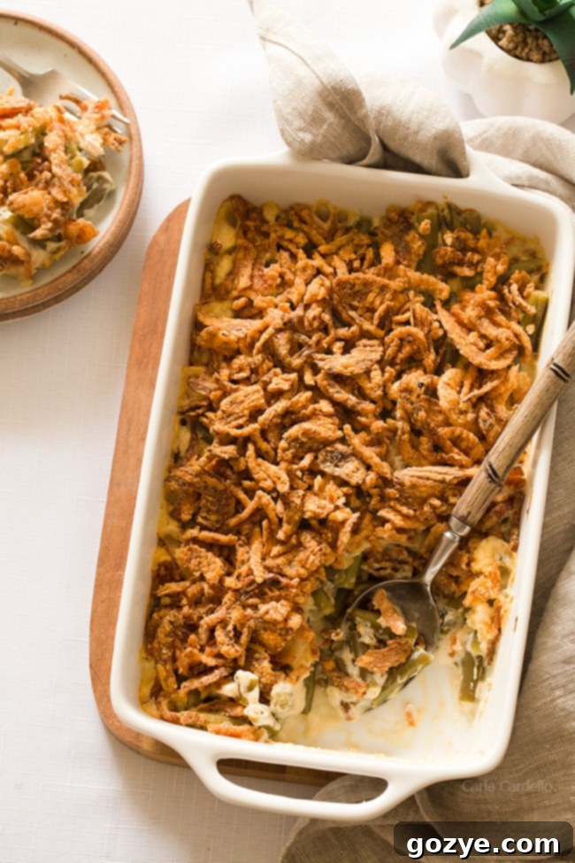 White casserole dish filled with homemade green bean casserole