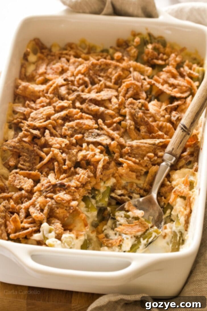 Close up of green bean casserole showing creamy texture and fresh ingredients
