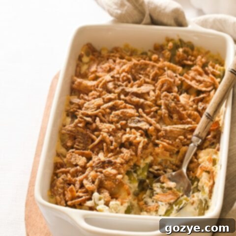 White casserole dish filled with green bean casserole