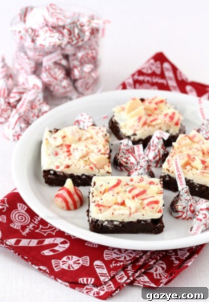 Fudgy Peppermint Bark Brownies with Candy Cane Kisses on a Cooling Rack