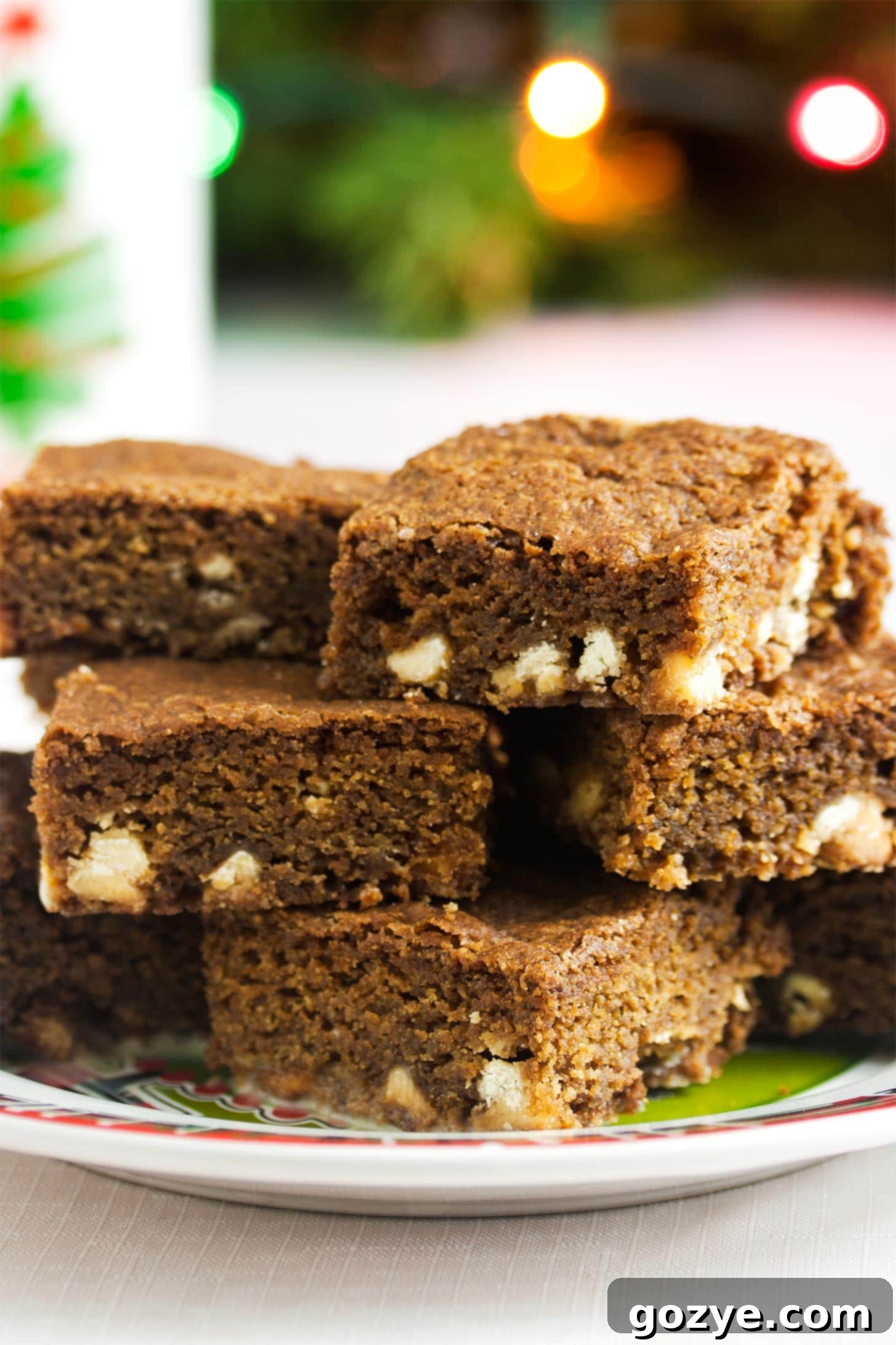 Warm Spice Blondie Bars 2 Gingerbread blondies stacked on a plate