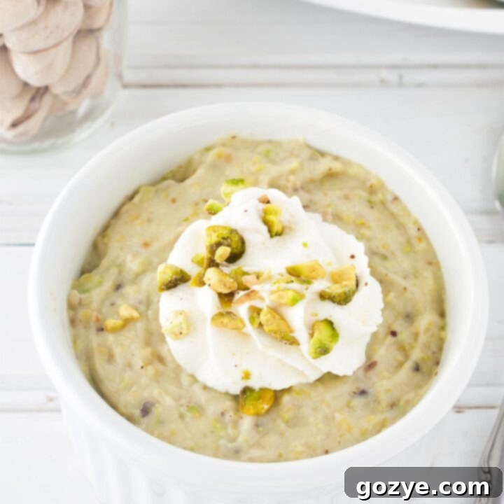Homemade pistachio pudding in white ramekin
