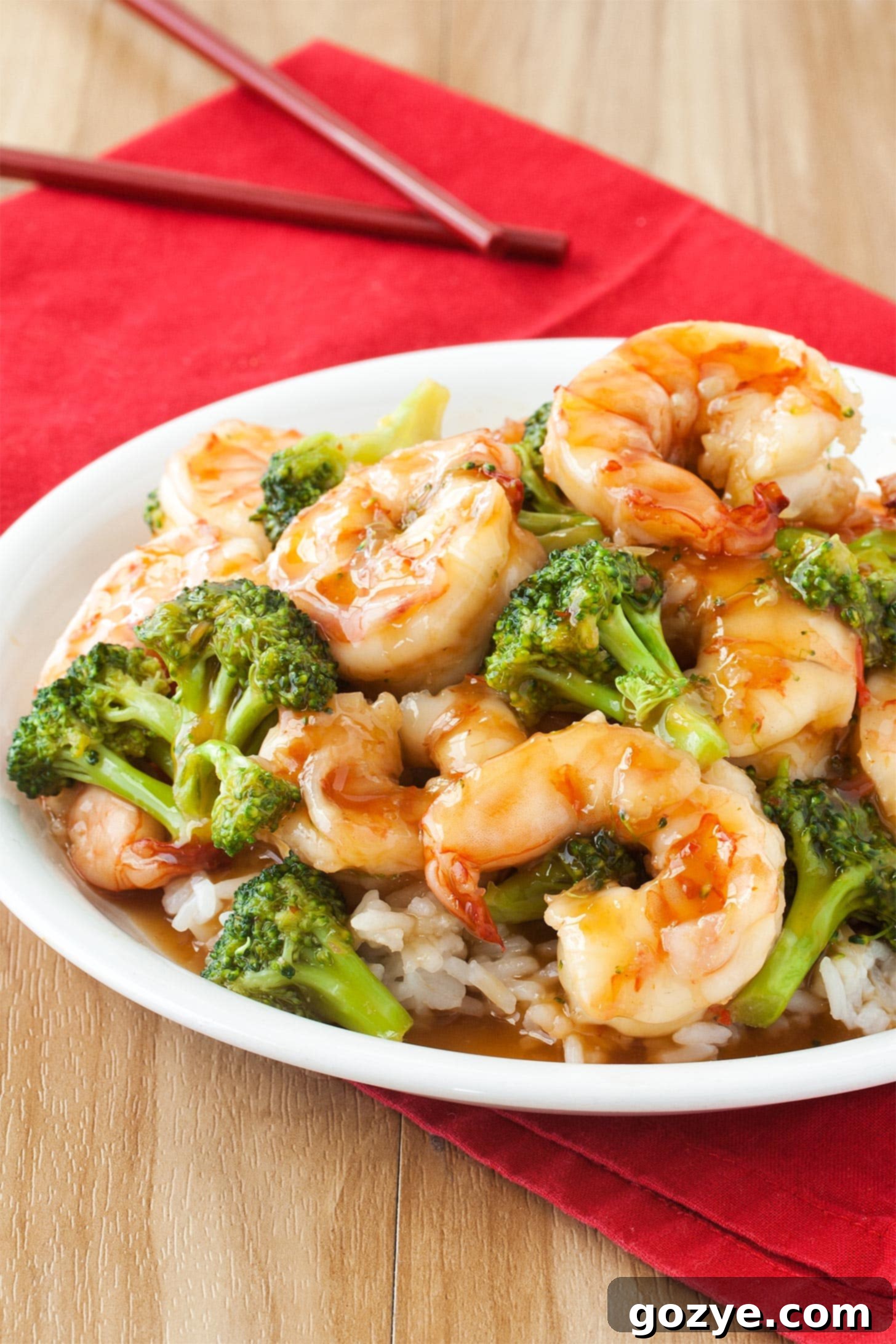 Plate of general tso shrimp with broccoli and rice