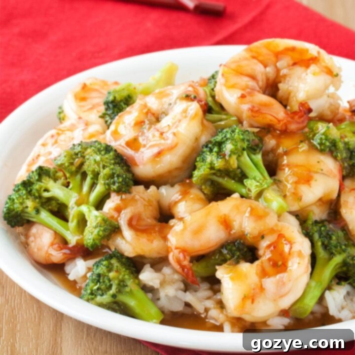 Plate of general tso shrimp with broccoli and rice