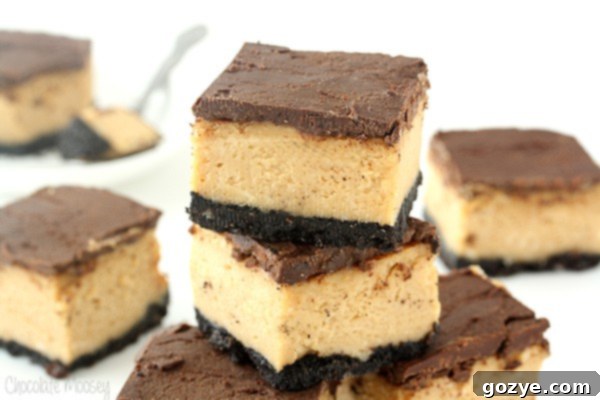 Close-up of a slice of Buckeye Cheesecake Bar showing the creamy peanut butter layer