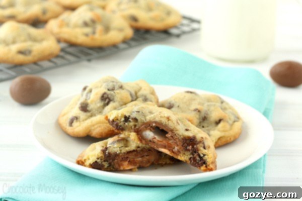 Cadbury Egg Cookies cut in half on a plate