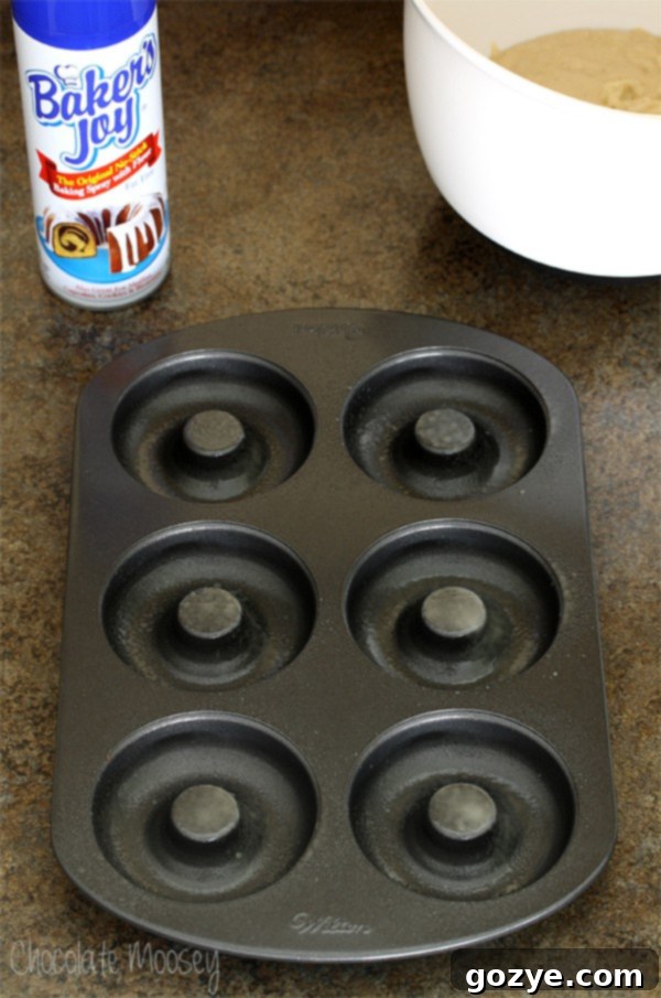Spraying Baked Doughnut Pan