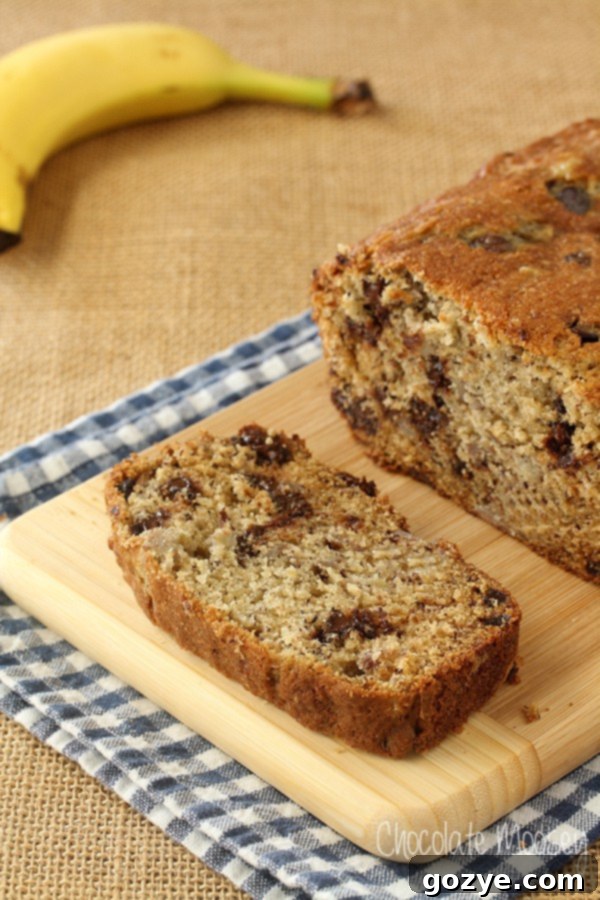 Close-up of a slice of Banana Chocolate Chip Bread with melty chocolate