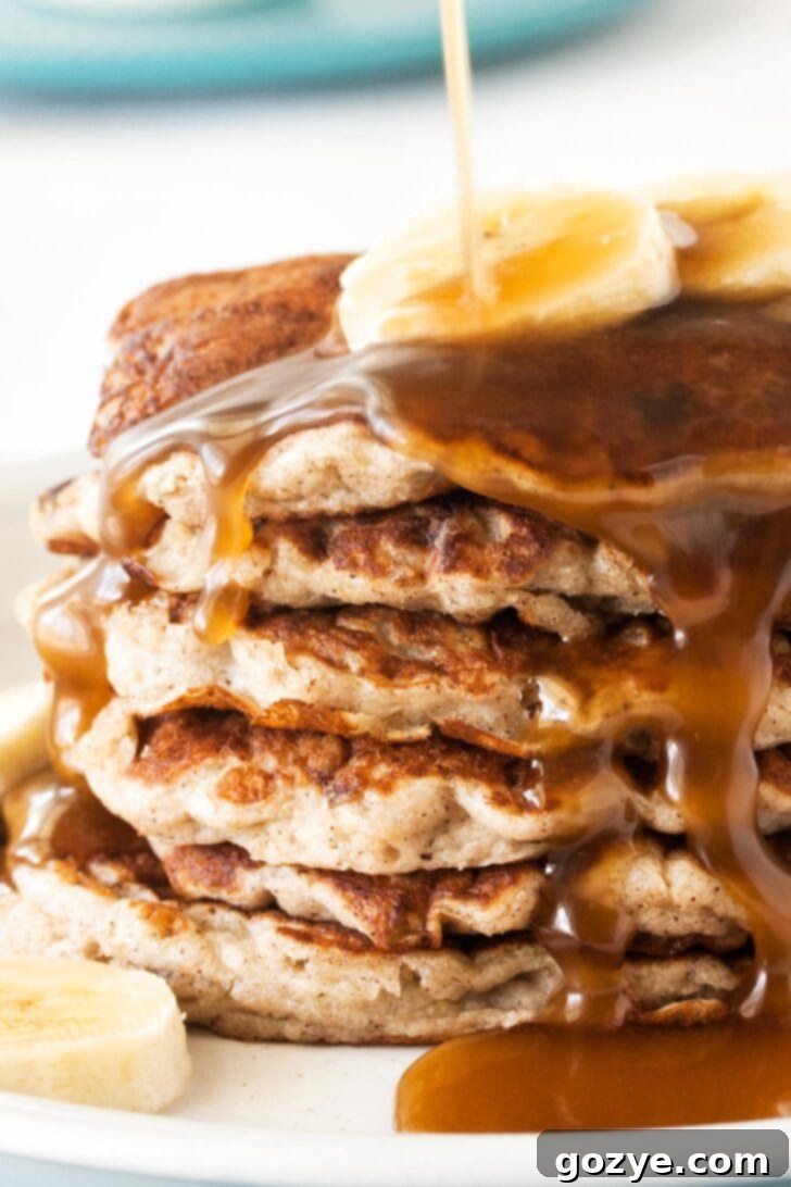 Dairy-Free Banana Coconut Milk Pancakes 3 Close-up view of fluffy banana coconut milk pancakes, showing their soft texture and golden edges, perfect for a dairy-free treat.