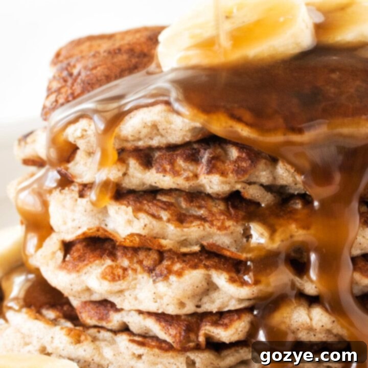 Dairy-Free Banana Coconut Milk Pancakes 8 Close up of fluffy banana coconut milk pancakes, a perfect dairy-free breakfast or brunch treat.