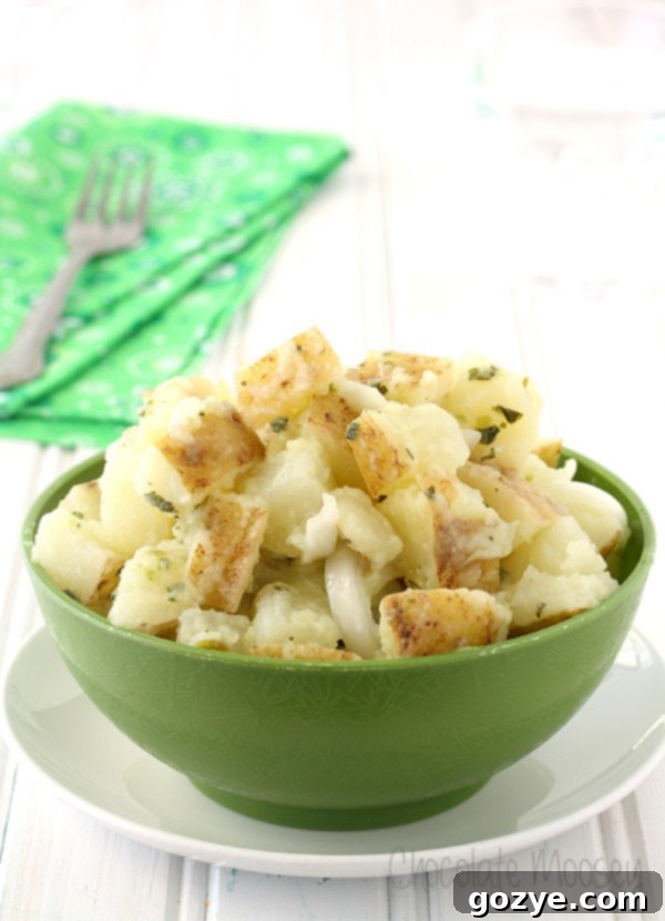 Italian potato salad in a green bowl, ready to be served