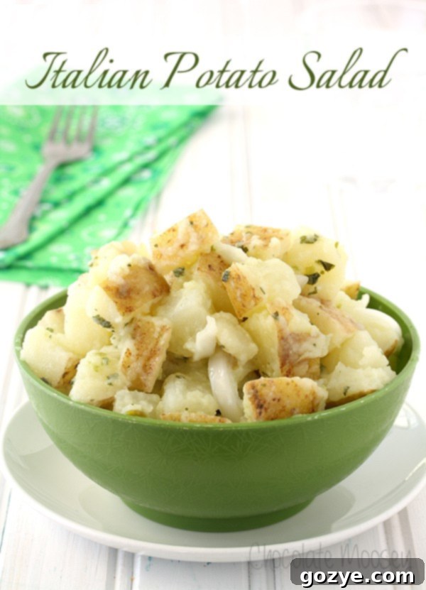 Italian Potato Salad in a green bowl with text overlay, 'Best No Mayo Italian Potato Salad'