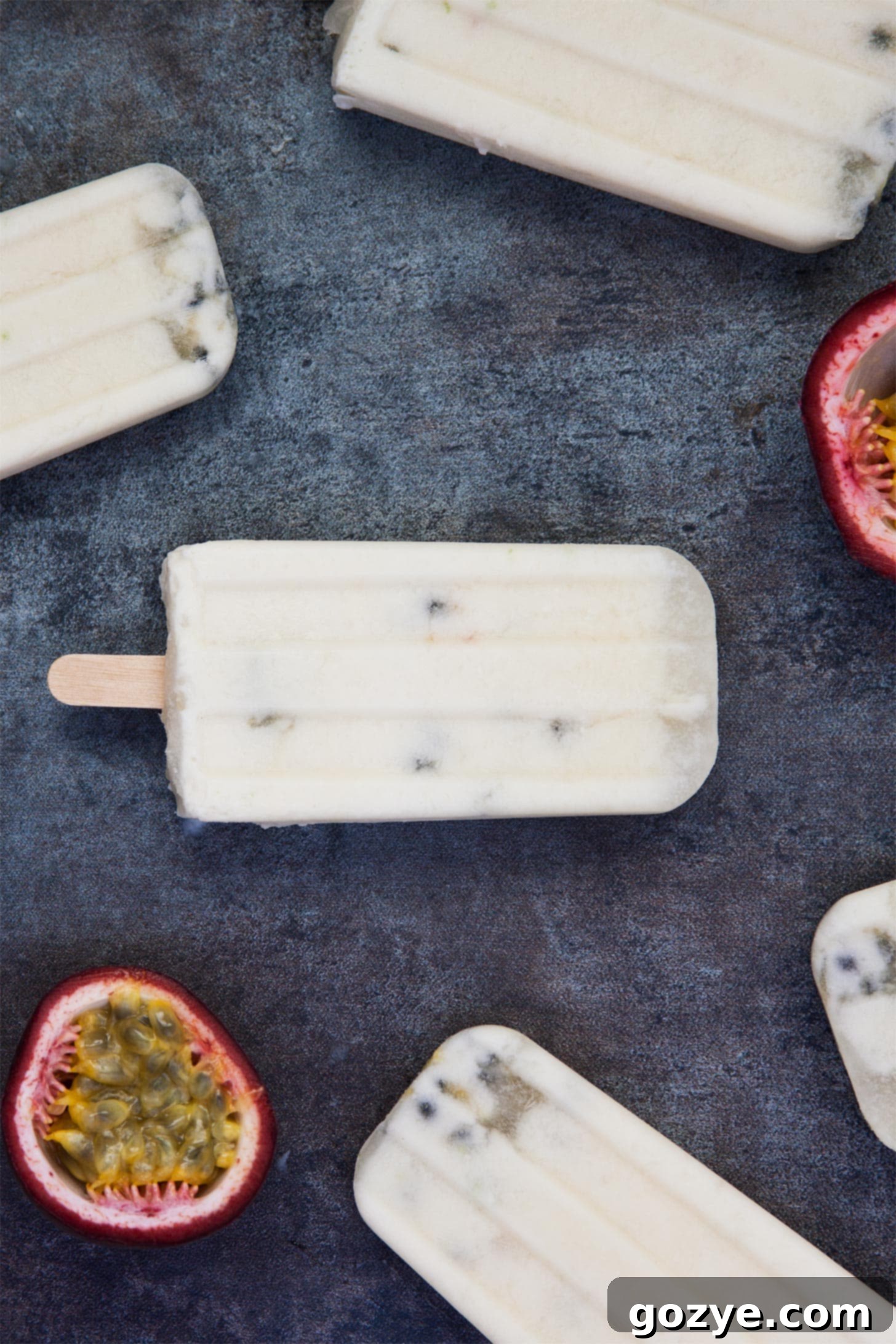 Close-up of Coconut Pops with coconut milk and passion fruit, showing the creamy texture and seeds