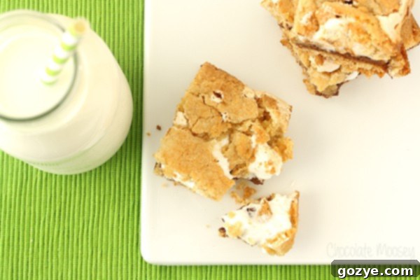 S'mores Cookie Bars 5 S'mores Cookie Crumb Bars cut into squares, showing gooey center