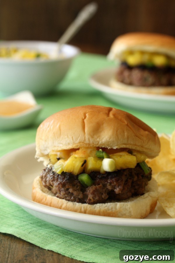 Delicious Sweet Chili and Pineapple Thai Burgers with sweet chili aioli and pineapple salsa served on a bun