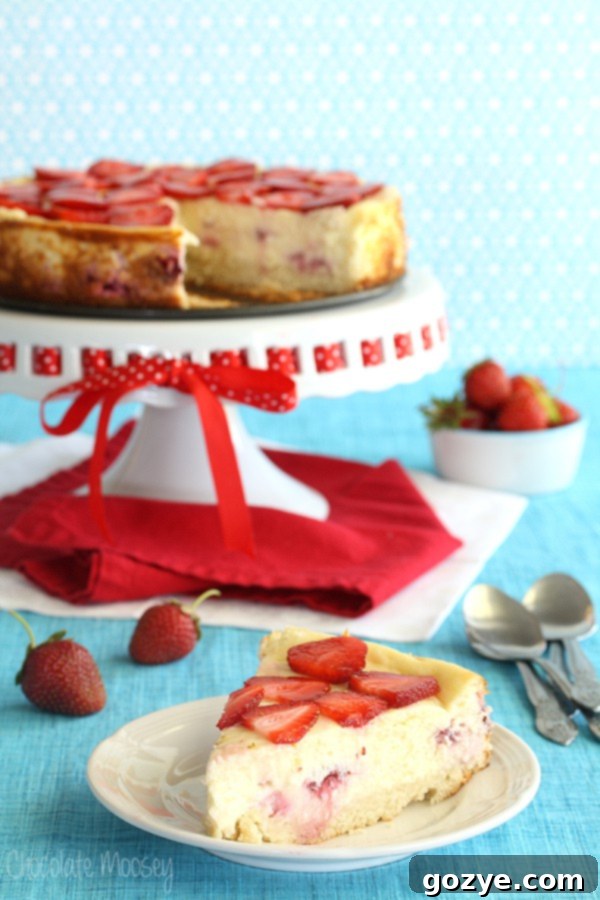 Strawberry Shortcake Cheesecake with fresh strawberries and sponge cake crust