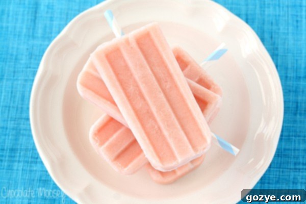 Watermelon Popsicles with Greek yogurt artfully arranged on a white serving plate