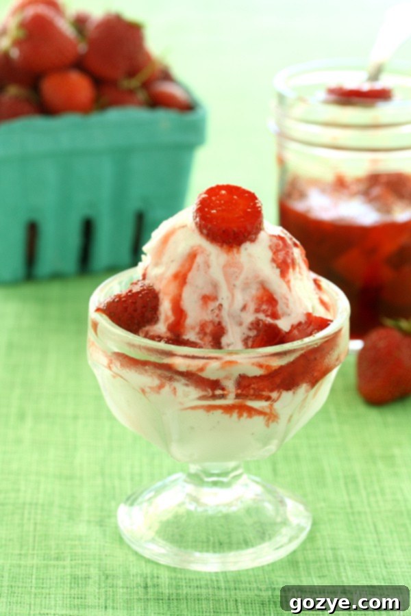 Strawberry sauce poured over ice cream