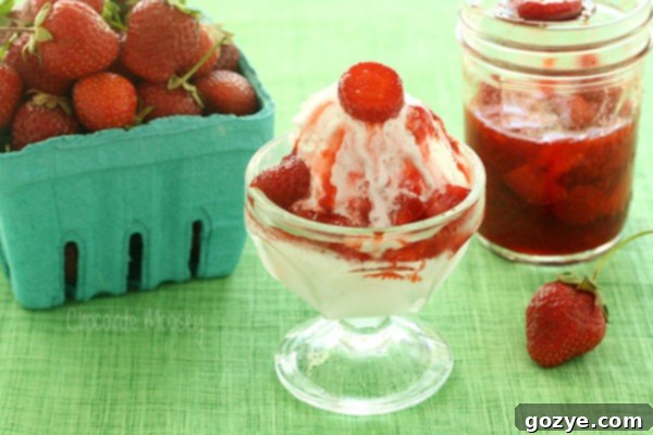 Strawberry sauce poured over ice cream