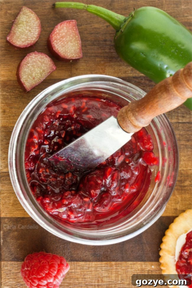 Jar of raspberry jalapeno jam with knife