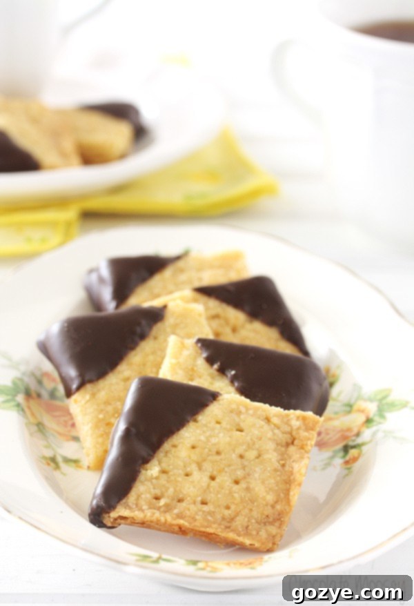 Chocolate-Dipped Orange Shortbread Cookies arranged beautifully for tea service