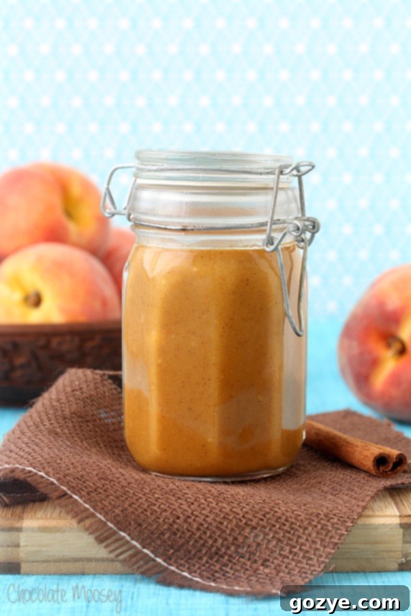 Close-up of fresh peaches being peeled for the sauce