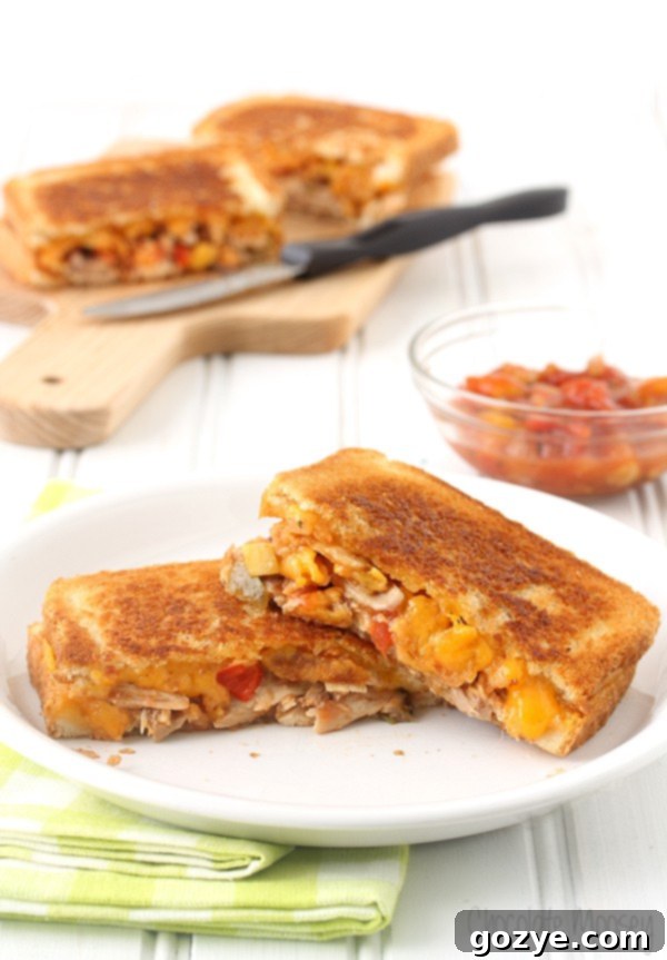 Fiesta Chicken Melt 3 Close-up of a Salsa Chicken Grilled Cheese Sandwich showing melted cheese and crispy edges