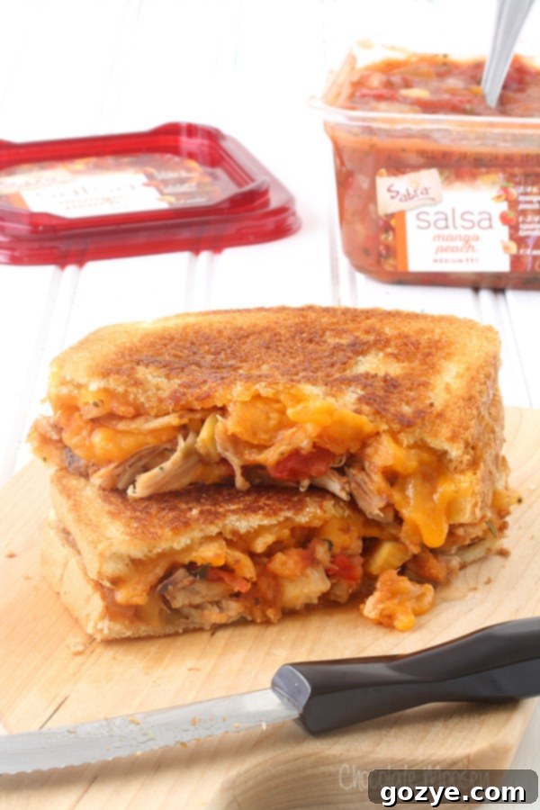 Fiesta Chicken Melt 4 Salsa Chicken Grilled Cheese on a cutting board, ready to be served