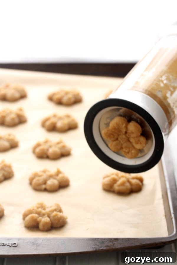 OXO Cookie Press being used to make Spritz Cookies