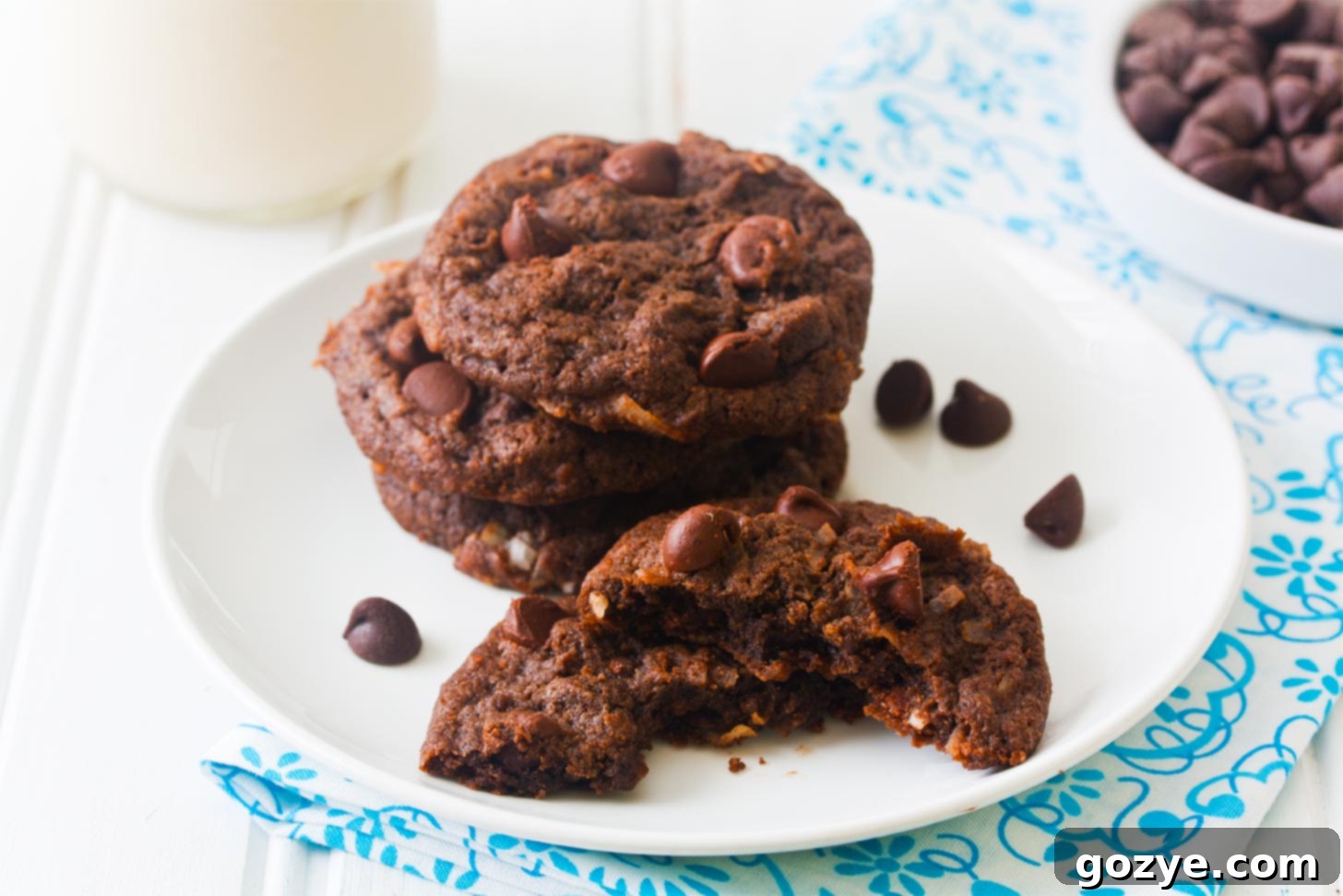 Plate of perfectly baked small batch chocolate coconut cookies with shredded coconut and chocolate chips