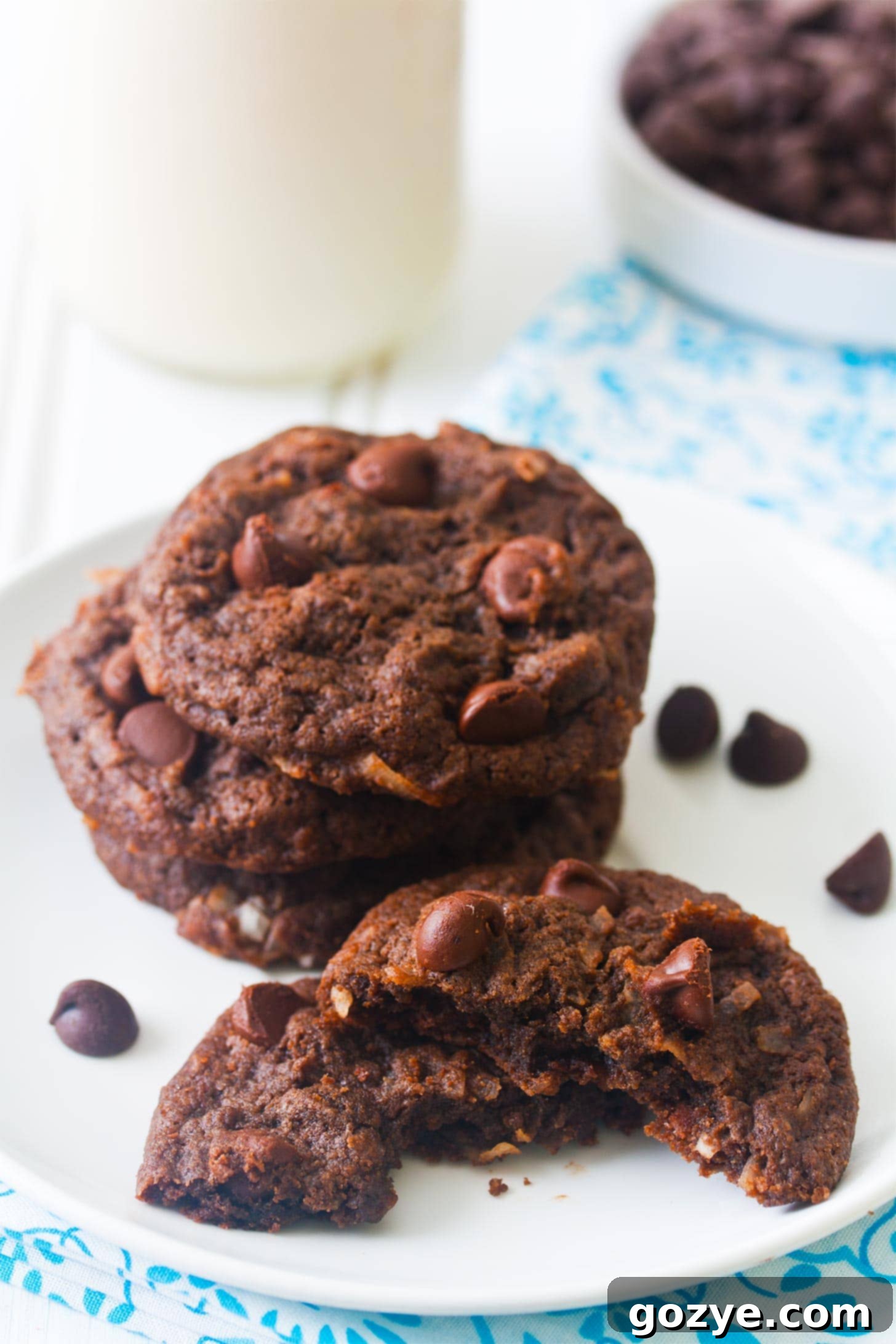 Stack of homemade eggless chocolate coconut cookies ready to be enjoyed