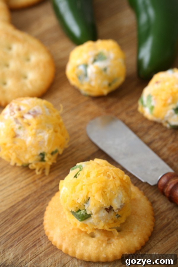 Close up of Jalapeno Popper Cheese Ball Bite on cracker