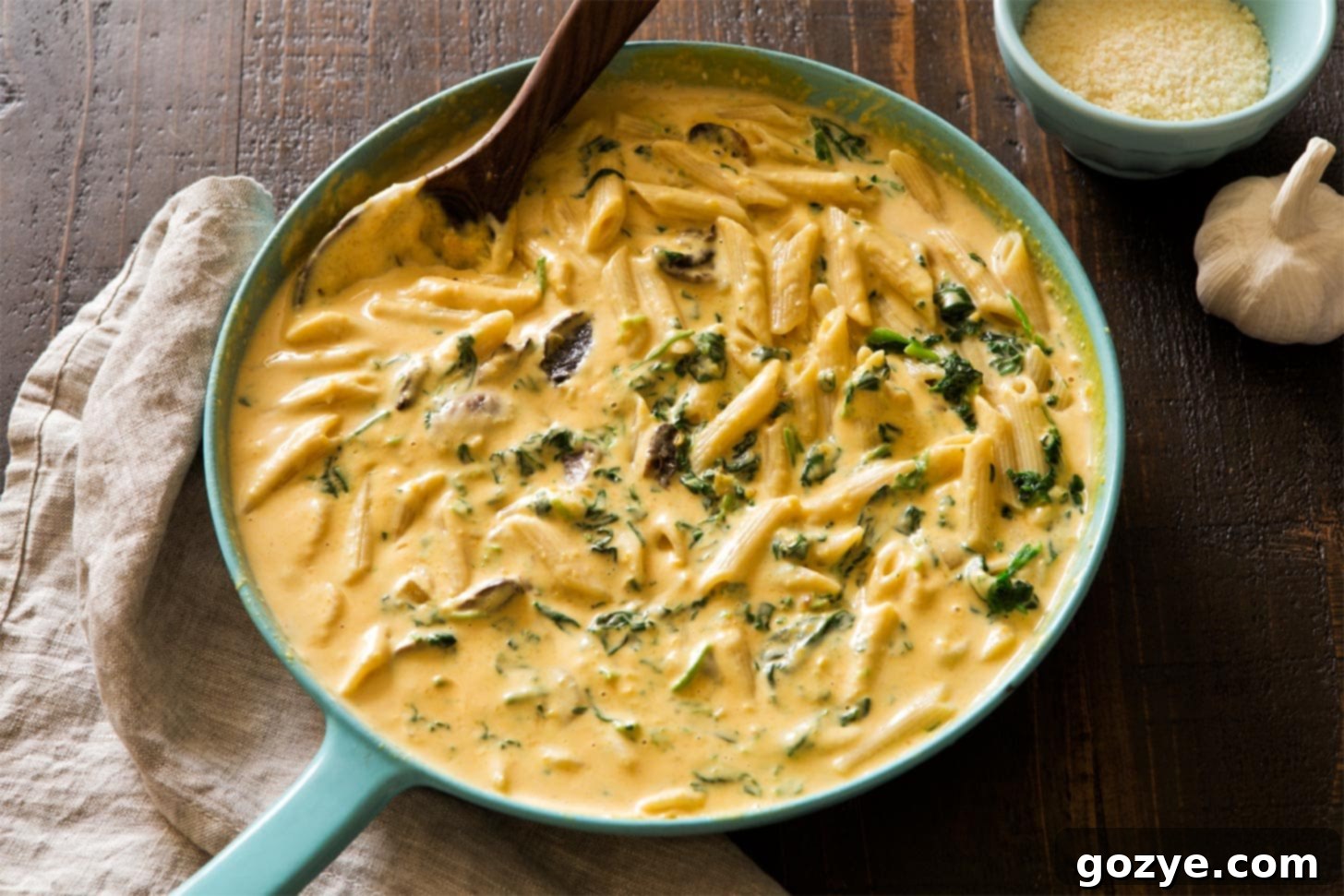 Butternut Squash Alfredo Pasta mixed in a skillet, ready to serve