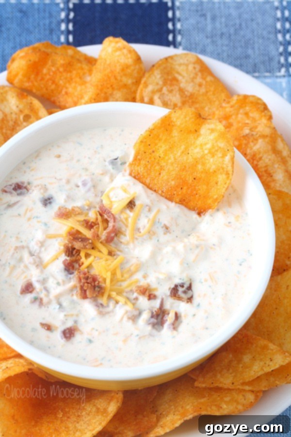 Bacon Cheddar Ranch Dip in bowl with BBQ chips