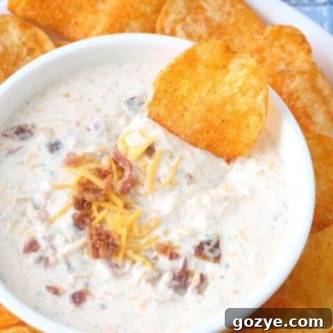 Loaded Bacon Cheddar Ranch Dip 5 Bacon Cheddar Ranch Dip in bowl with BBQ chips