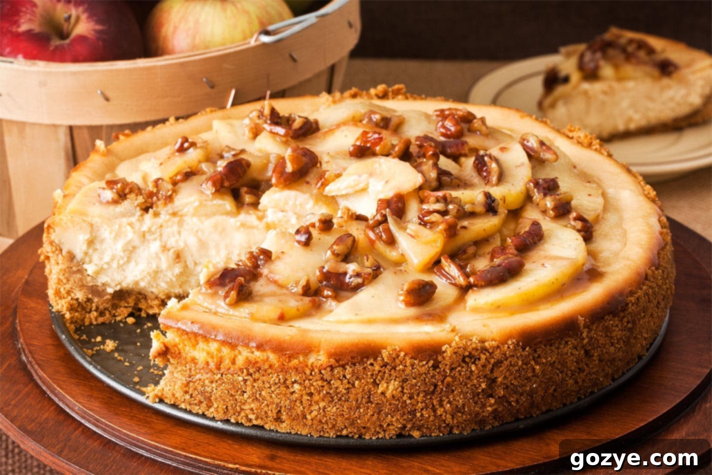 Caramel apple cheesecake with a slice missing