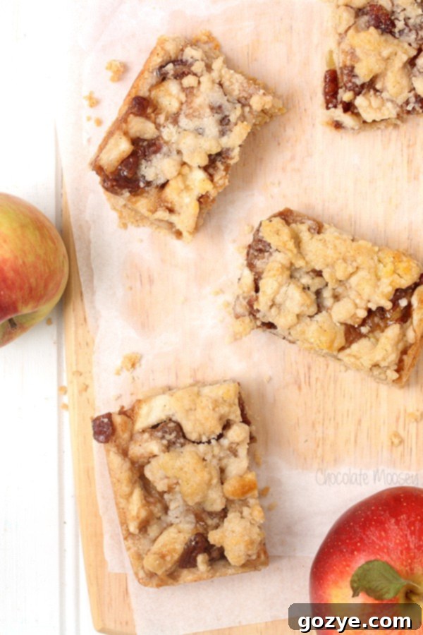 Apple Pie Crumb Bars with pecans scattered on top before baking, ready for the oven