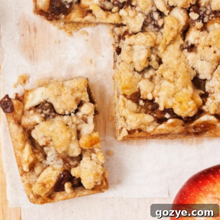 Close up of apple pie bars, highlighting the delicious texture and layers