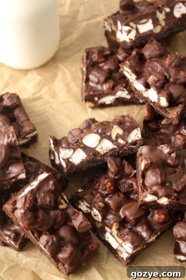 Stacked Rocky Road Cookie Fudge Bars, showcasing their layers