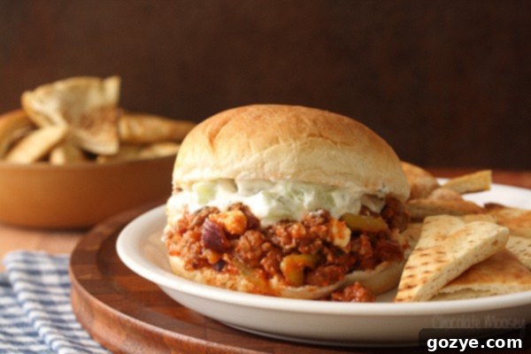 Greek Sloppy Joes made with ground lamb, peperoncini, feta cheese, and cucumber yogurt sauce