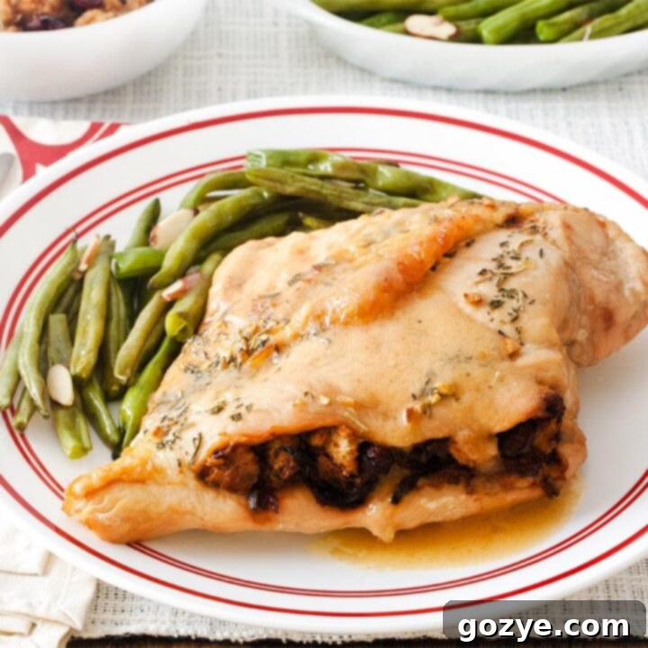 Stuffed turkey breast on plate with green beans