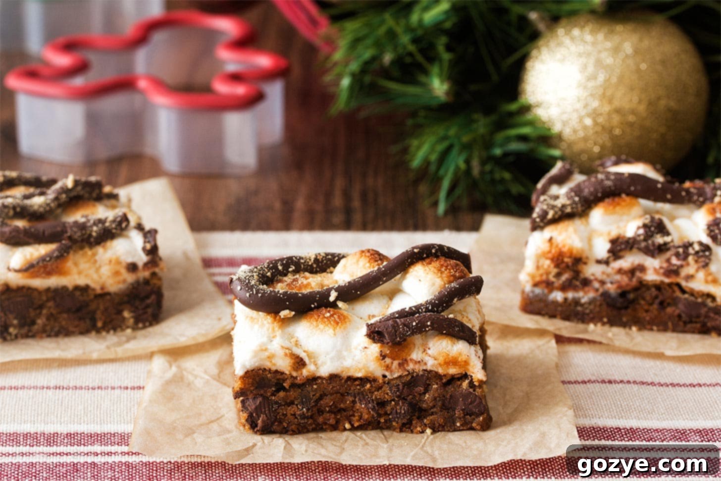 Three gingerbread molasses bars, showcasing their soft texture and rich brown color.
