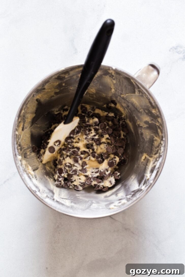 Stirring in chocolate chips for chocolate chip cheeseball by hand