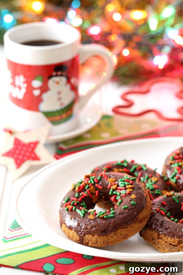 Delicious Chocolate Gingerbread Baked Doughnuts topped with festive gingerbread sprinkles for Christmas holiday baking