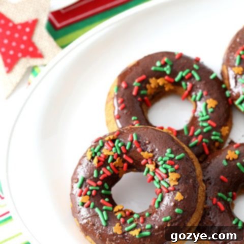 Finished Chocolate Gingerbread Baked Doughnuts with chocolate glaze and gingerbread sprinkles