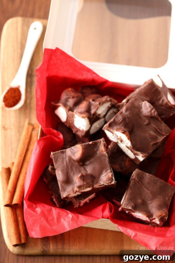 Spicy Mexican Chocolate Fudge 3 A close-up of a square of Mexican Hot Chocolate Fudge, topped with soft mini marshmallows, showcasing its rich texture